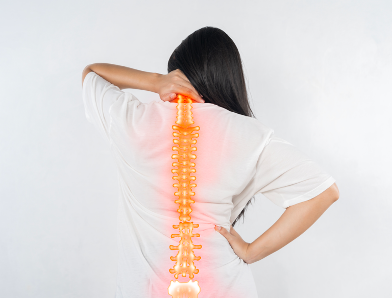 pain-spine-woman-with-backache-gray-background 1